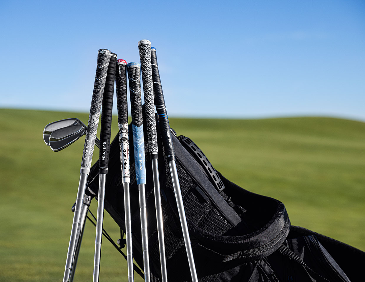 golf clubs leaning on golf bag