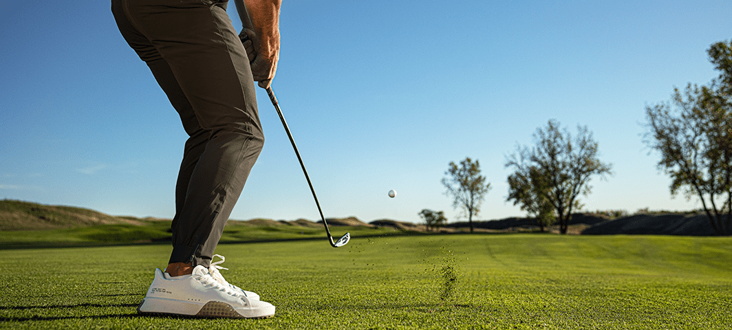 Man chipping a golf ball