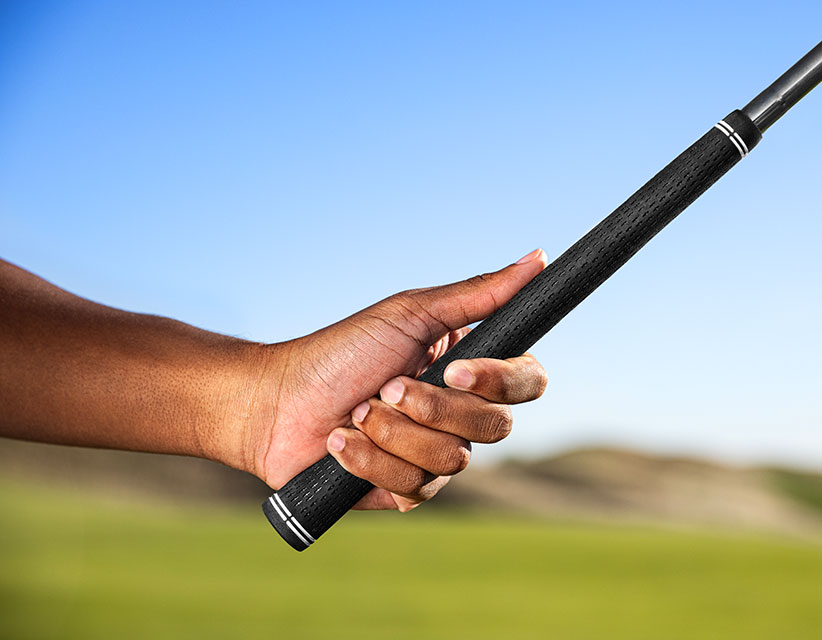 hand holding a grip that is too small