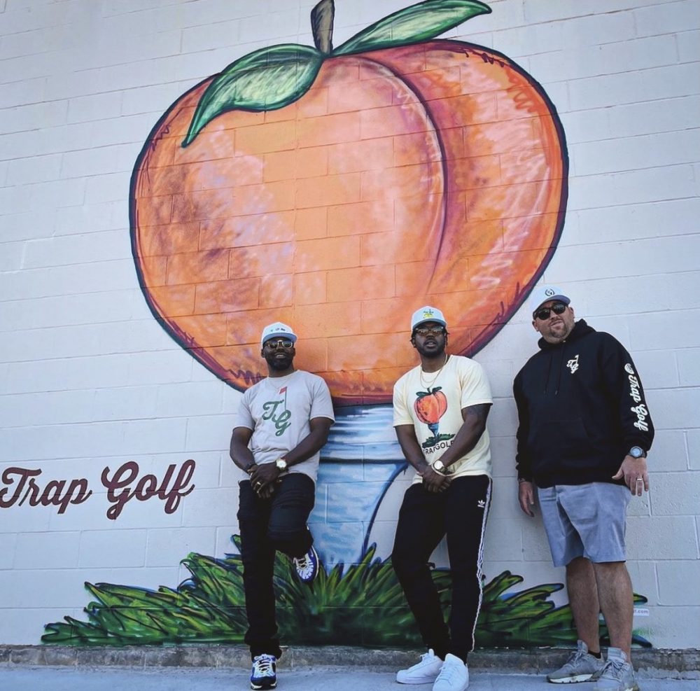 Roger Steele with Trap Golf founder Wayne Birch and artist Aaron Munn