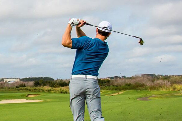 Golfer looking down fairway