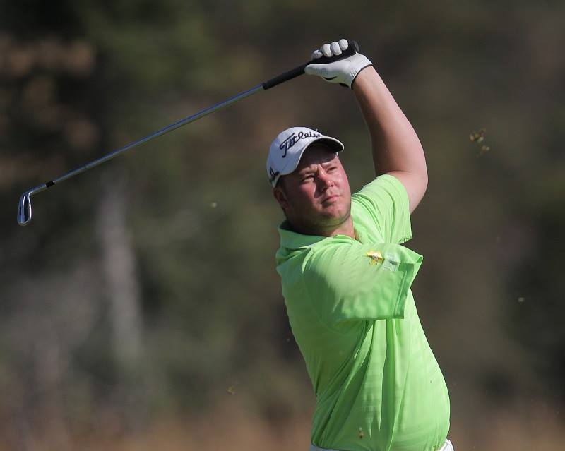 Reinard Schuhknecht swinging a golf club with one arm