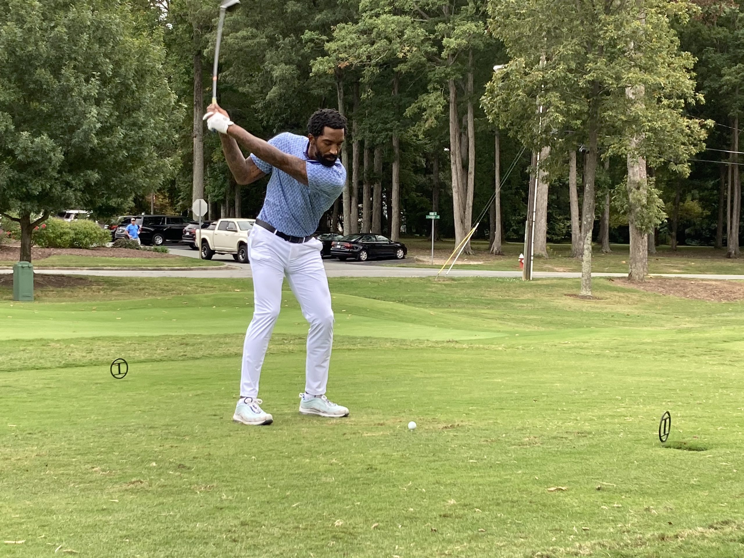 J.R. Smith swinging a golf club